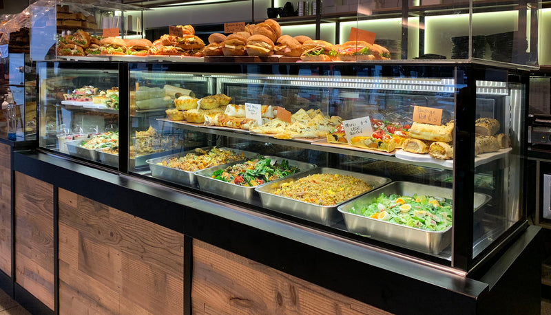 Display case with various food items in a restaurant setting